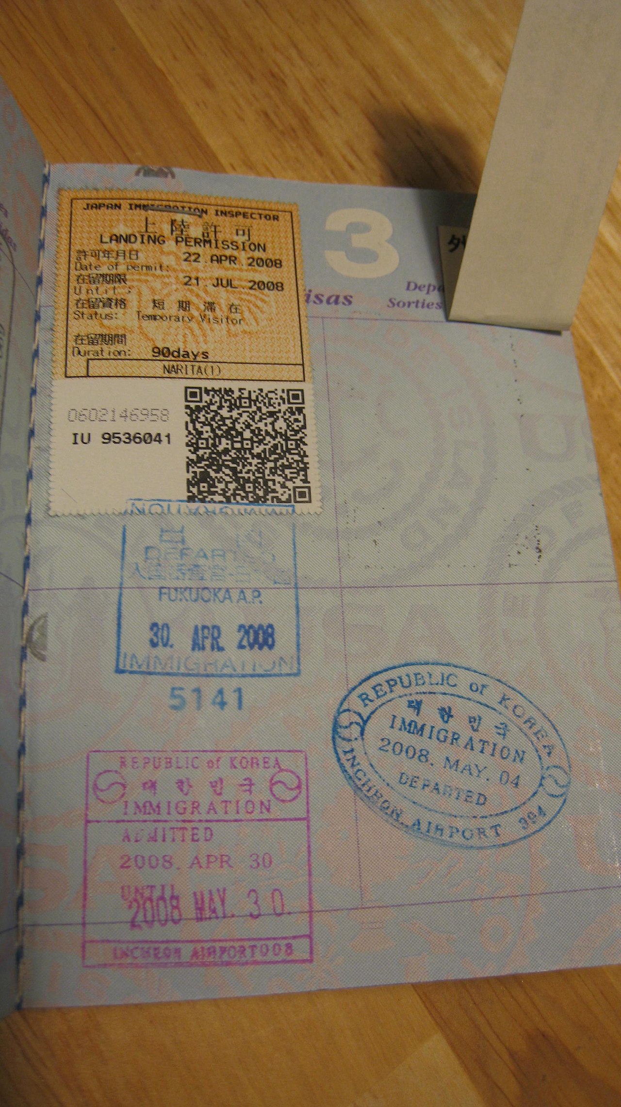 Passport pages with visa stamps representing family migration