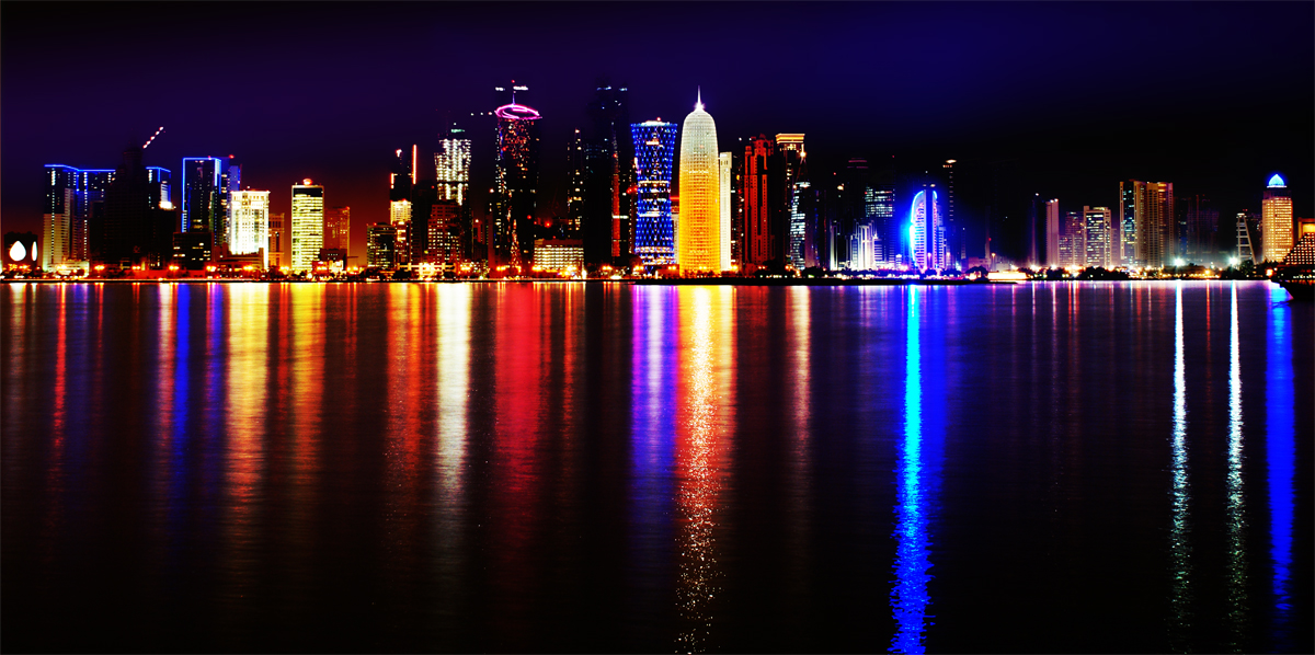 The illuminated skyline of Doha, Qatar, a major destination for Kenyan labour migrants in the Gulf