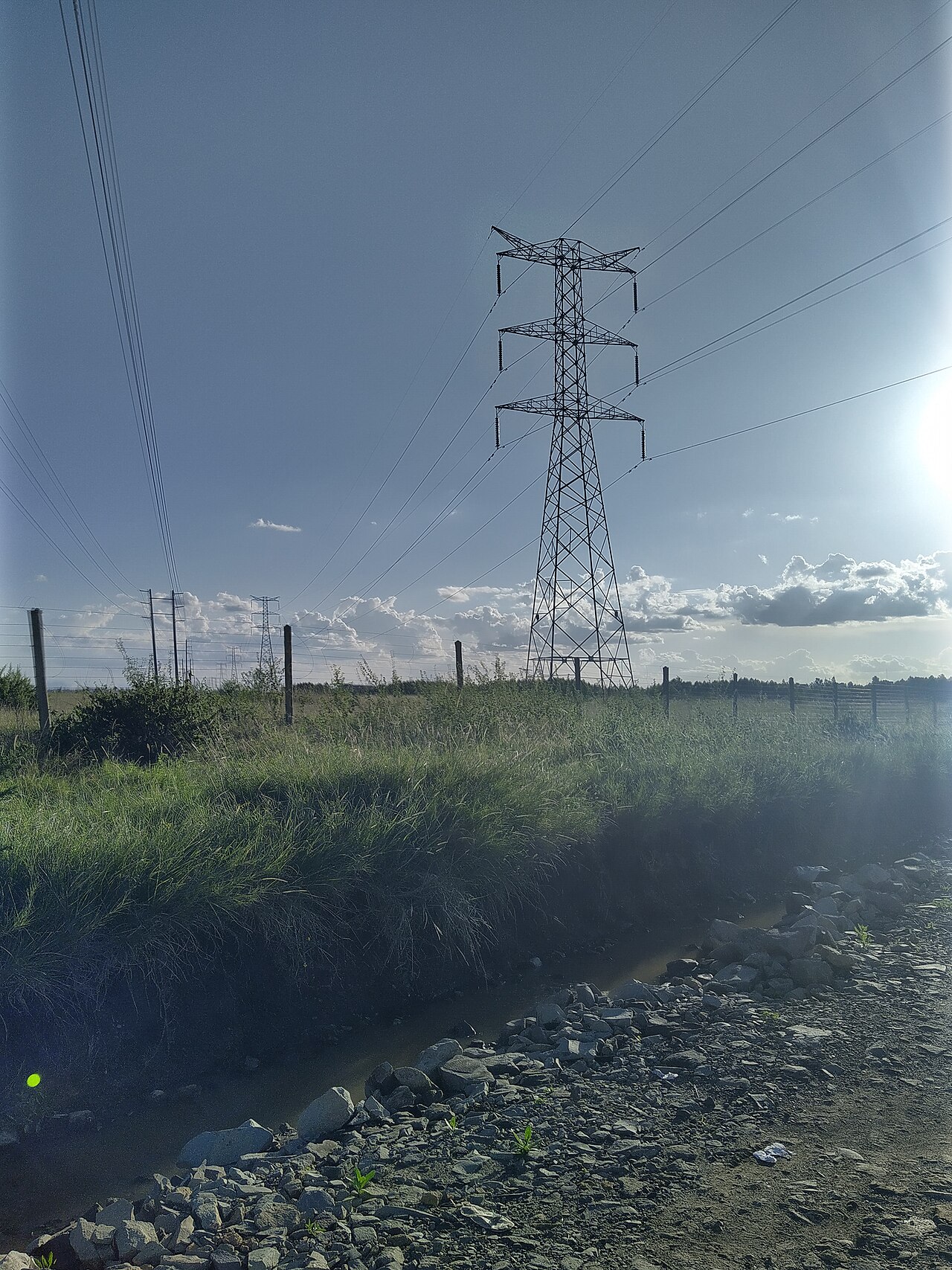 Kenya Power transmission lines and electricity pylons at sunset